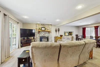 a living room with a couch and a fireplace at Skyline Manor in South Lake Tahoe