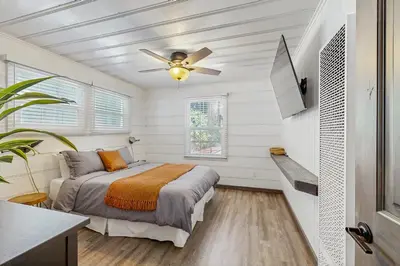 a bedroom with a bed and a ceiling fan at Manzanita Holiday 4 in South Lake Tahoe
