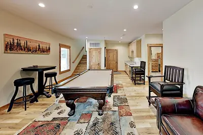 a living room with a ping pong table in it at Saponi Escape in South Lake Tahoe