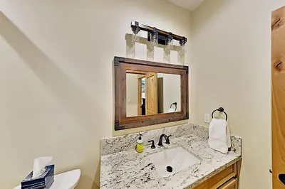 a bathroom with a sink and a mirror at Saponi Escape in South Lake Tahoe