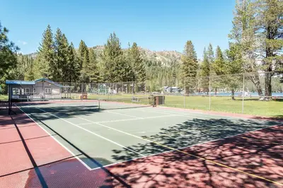 a tennis court with a net at Wolfgang Dreams in Truckee