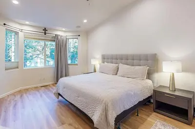 a bedroom with a large bed and a window at Koyukon Escape in South Lake Tahoe