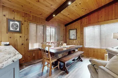 a dining room with a wooden table and chairs at Cozy Tahoe Donner Retreat in Truckee