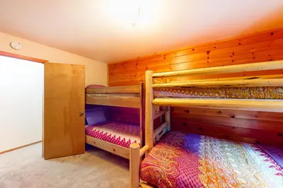 a bedroom with two bunk beds in a house at St Bernard Oasis in Truckee