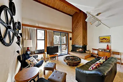 a living room with a couch and a fireplace at Aspen Grove Escape in Truckee