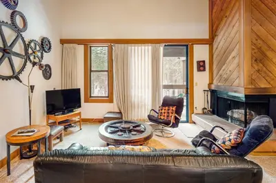 a living room with a couch and a fireplace at Aspen Grove Escape in Truckee