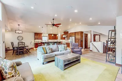 a living room with a couch and a table at Prospector Palace in South Lake Tahoe