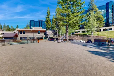 a large parking lot with a building and trees at Resort at Squaw Creek's 806 & 808 in Olympic Valley