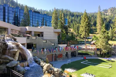 a resort with a waterfall and a water park at Resort at Squaw Creek's 605 in Olympic Valley