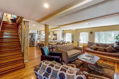 a living room with a couch and a table at Golden Adventures in Kings Beach