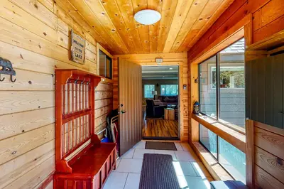 a hallway of a cabin with a wooden ceiling at Golden Adventures in Kings Beach