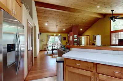 a kitchen with a stainless steel refrigerator and wooden ceilings at Silverado Escape in Tahoe City