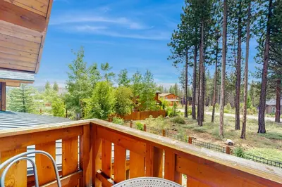 a wooden balcony with a view of a yard at Mount Olympia Oasis in South Lake Tahoe