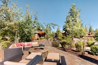 a patio with furniture and a firepit in a yard at Sagebrush Charms in Truckee