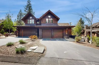 a house with a garage in front of it at Sagebrush Charms in Truckee