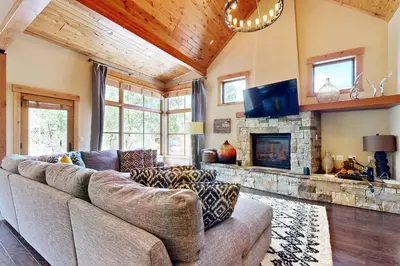 a living room with a couch and a fireplace at Sagebrush Charms in Truckee