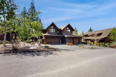 a large house with a driveway in front of it at Sagebrush Charms in Truckee