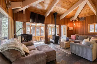 a living room with a couch and a fireplace at Dodawah Oasis in Carnelian Bay