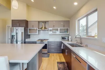 a large kitchen with a sink and a refrigerator at Tahoe Keys Haven in South Lake Tahoe
