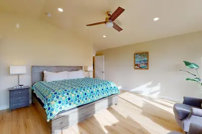 a bedroom with a bed and a ceiling fan at Tahoe Keys Haven in South Lake Tahoe