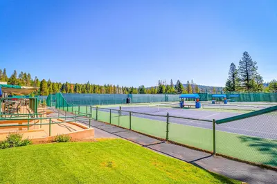 a tennis court with two tennis courts at Northwoods Paradise in Truckee