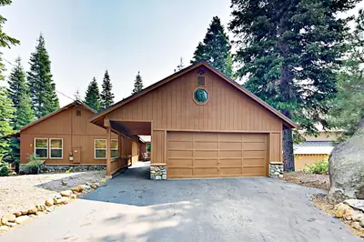 a house with a garage with a driveway at Zermatt Getaway in Truckee
