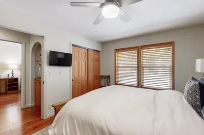 a bedroom with a bed and a ceiling fan at Zermatt Getaway in Truckee