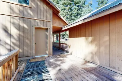 a porch of a wooden house with a door at Zermatt Getaway in Truckee