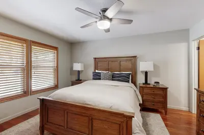 a bedroom with a bed and a ceiling fan at Zermatt Getaway in Truckee