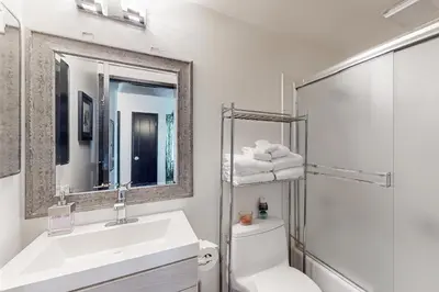 a bathroom with a sink and a toilet and a mirror at Scott Peak Lodges Condo in Alpine Meadows