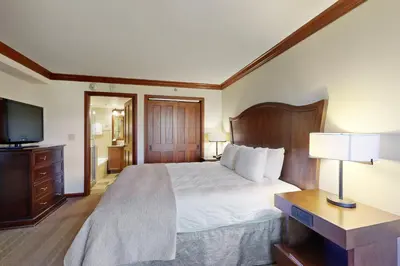 a hotel room with a bed and a television at Resort at Squaw Creek's 810 & 812 in Olympic Valley