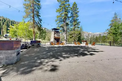 a large parking lot with chairs and a fence at Resort at Squaw Creek's 810 & 812 in Olympic Valley