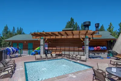 a swimming pool with a pavilion and a playground at Pathway Paradise in Truckee