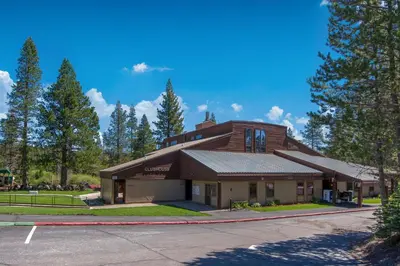 a large building on a street with trees at Pathway Paradise in Truckee