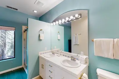 a bathroom with a sink and a mirror at Pathway Paradise in Truckee