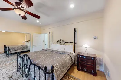a bedroom with a bed and a ceiling fan at Pathway Paradise in Truckee