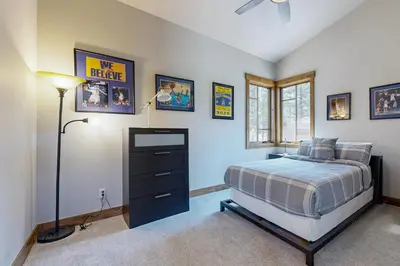 a bedroom with a bed and a dresser at Henness Haven in Truckee