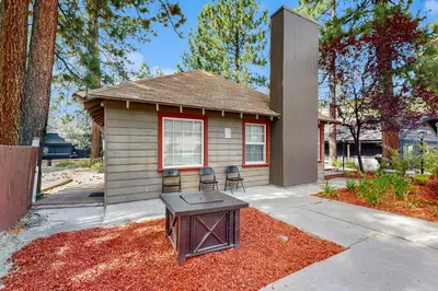 a small house with two chairs in front of it at Manzanita Holiday 5 in South Lake Tahoe