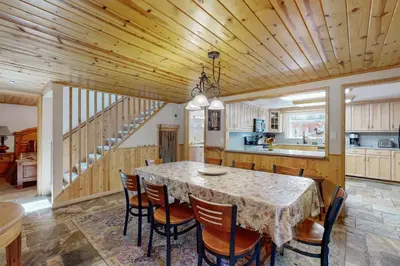 a kitchen and dining room with a table and chairs at Hank Monk Manor in South Lake Tahoe