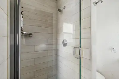 a shower stall with a glass door in a bathroom at Manzanita Holiday 2 in South Lake Tahoe