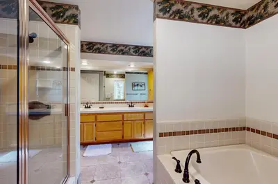 a bathroom with a tub and a shower at Gold Dust Escape in South Lake Tahoe