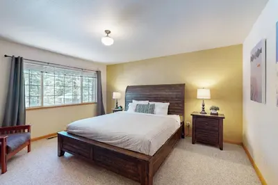 a bedroom with a large bed and a window at Gold Dust Escape in South Lake Tahoe