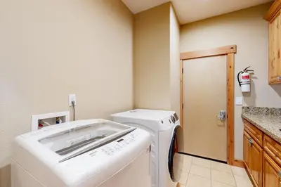 a laundry room with a washing machine in it at Wagon Wood Retreat in South Lake Tahoe