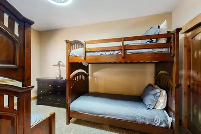 a bedroom with two bunk beds and a dresser at Wagon Wood Retreat in South Lake Tahoe