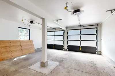 an empty garage with a large room with windows at North Lake Adventure in Carnelian Bay