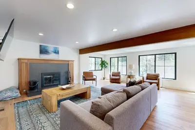 a living room with a couch and a fireplace at North Lake Adventure in Carnelian Bay
