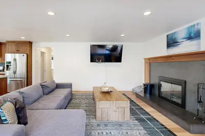 a living room with a couch and a fireplace at North Lake Adventure in Carnelian Bay