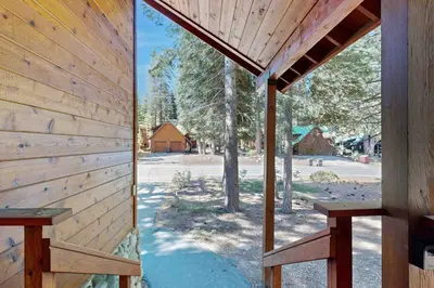 a view of a wooden building with two benches at Schussing Escape in Truckee