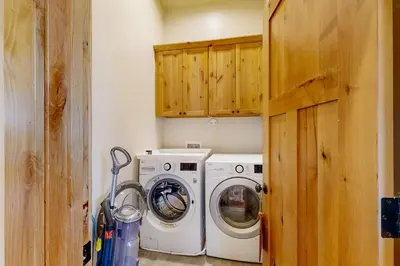 a laundry room with a washer and dryer at Luxury Mountain Retreat in South Lake Tahoe