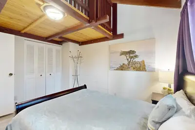 a bedroom with a bed and a wooden ceiling at Ski Run Village in South Lake Tahoe